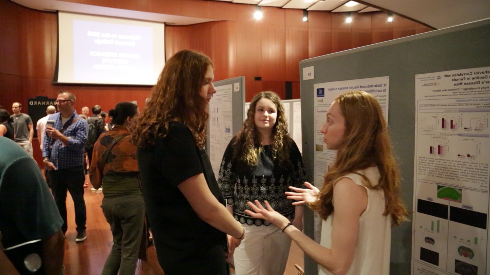 Students discussing research at the 2018 Poster Session